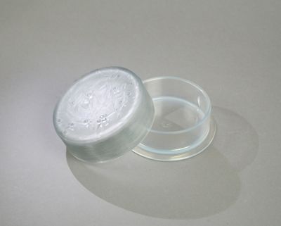 a glass jar with a lid sitting on a table
