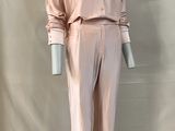 pink silk pajamas and pants on a mannequin base