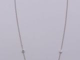 silver plated necklace with a square shaped pendant and a chain with beads