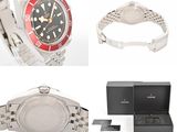 two watches and a watch box on a white background