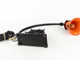 an orange light that is on top of a black lamp