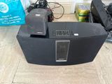 a black speaker that is sitting on the floor