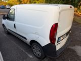 a white van that is parked in a parking lot