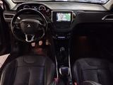 the interior of a small car with a steering wheel and dashboard