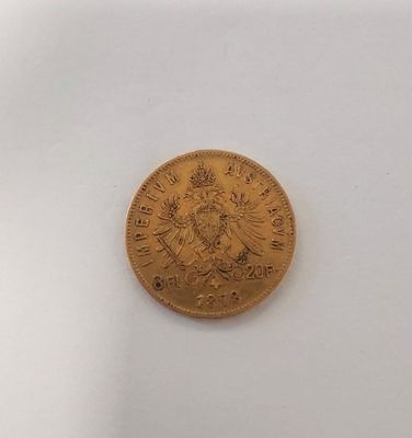 an image of a gold coin on a white surface