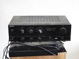 a black radio sitting on top of a wooden box