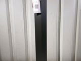 an image of a black metal pole with a label on it