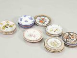 a lot of plates that are sitting on a table