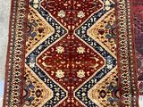 two oriental rugs on display in a room