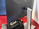 a computer monitor sitting on top of a red table