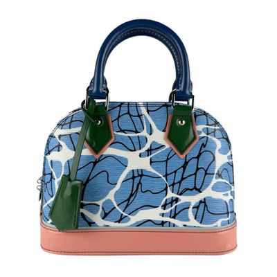 the blue and white handbag has a pink handle and a green handle