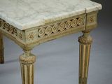 an image of a marble topped table with ornate carvings on the top