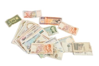 a pile of money sitting on top of a white table