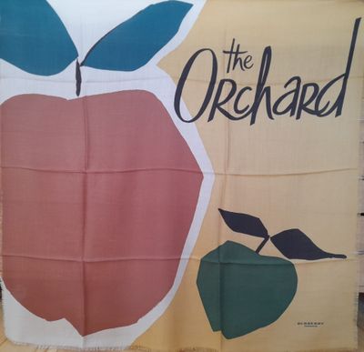 a banner that says the orchard with an apple on it