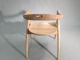 a wooden chair with a wooden seat on a white background