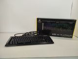 a computer keyboard and a mouse on a table