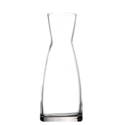 a glass vase that is sitting on a table