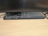 a flat screen tv sitting on top of a wooden table