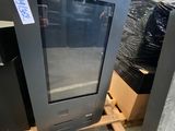 a television that is sitting on a pallet in a warehouse