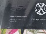 a close up of a black and white business card on a bed