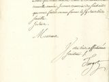 un vieux document sur lequel figure une lettre manuscrite