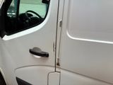 a white van that is parked on the side of the road