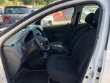 the interior of a white car with black seats and a steering wheel