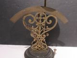 a clock that is on a stand on a table