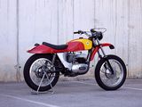 a red and yellow motorcycle parked in a parking lot