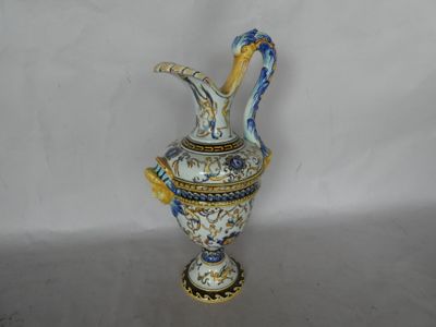 a blue and white vase with a bird on it