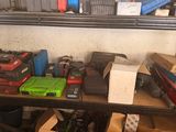 a shelf full of assorted items in a garage