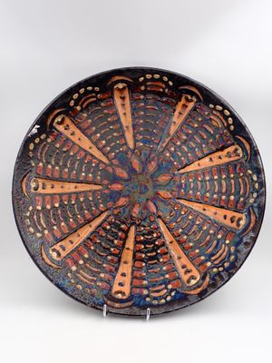a close up of a plate with a design on it