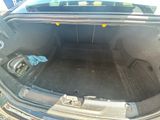 a trunk of a car that has a lot of stuff in it