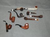 a lot of different types of pipes on the table