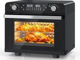 a black oven with food inside of it on a white surface