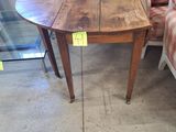 a small table with a chair and a lamp on it