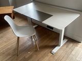 an image of a desk with a chair in a room