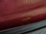 a chanel bag sitting on a table in a room