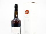 a bottle of wine sitting next to a box of wine