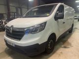 the white van is parked in a warehouse with other vehicles