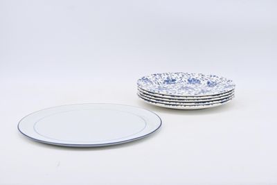 a stack of plates sitting next to each other on a table