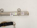 a metal pipe with a keychain attached to it