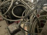 a pile of wires and other electrical equipment in a garage