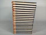 several books stacked on top of each other on a table
