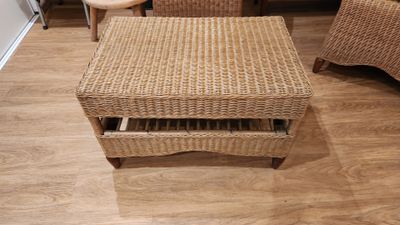 an image of a wicker coffee table with a drawer underneath it