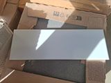 a pile of boxes with a white sheet on top of it