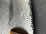 a knife that is laying on top of a table