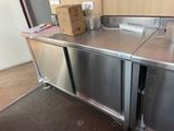 a stainless steel counter with a box on top of it