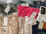 many different types of clothing on the table