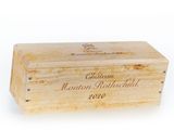 an empty wooden box with a wine label on it